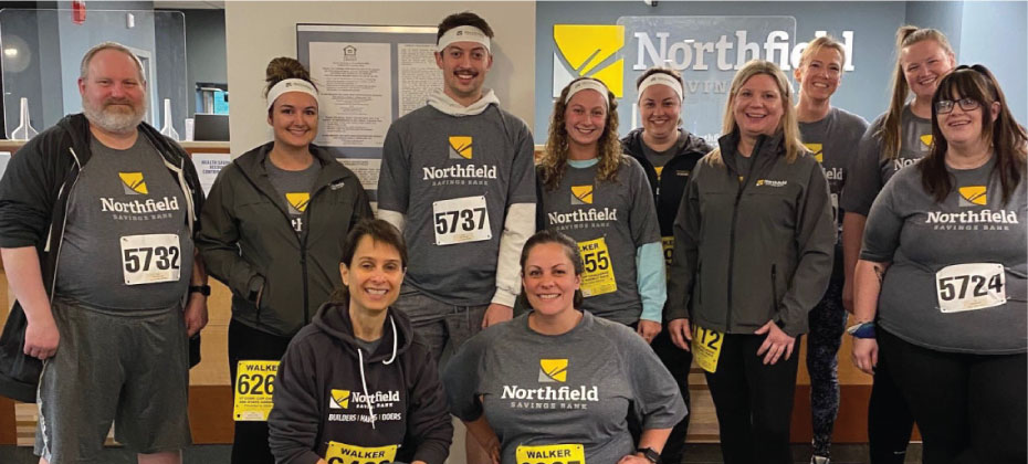 Team NSB poses together for a photo op at the Montpelier branch before taking to the streets for the Vermont Corporate Cup.