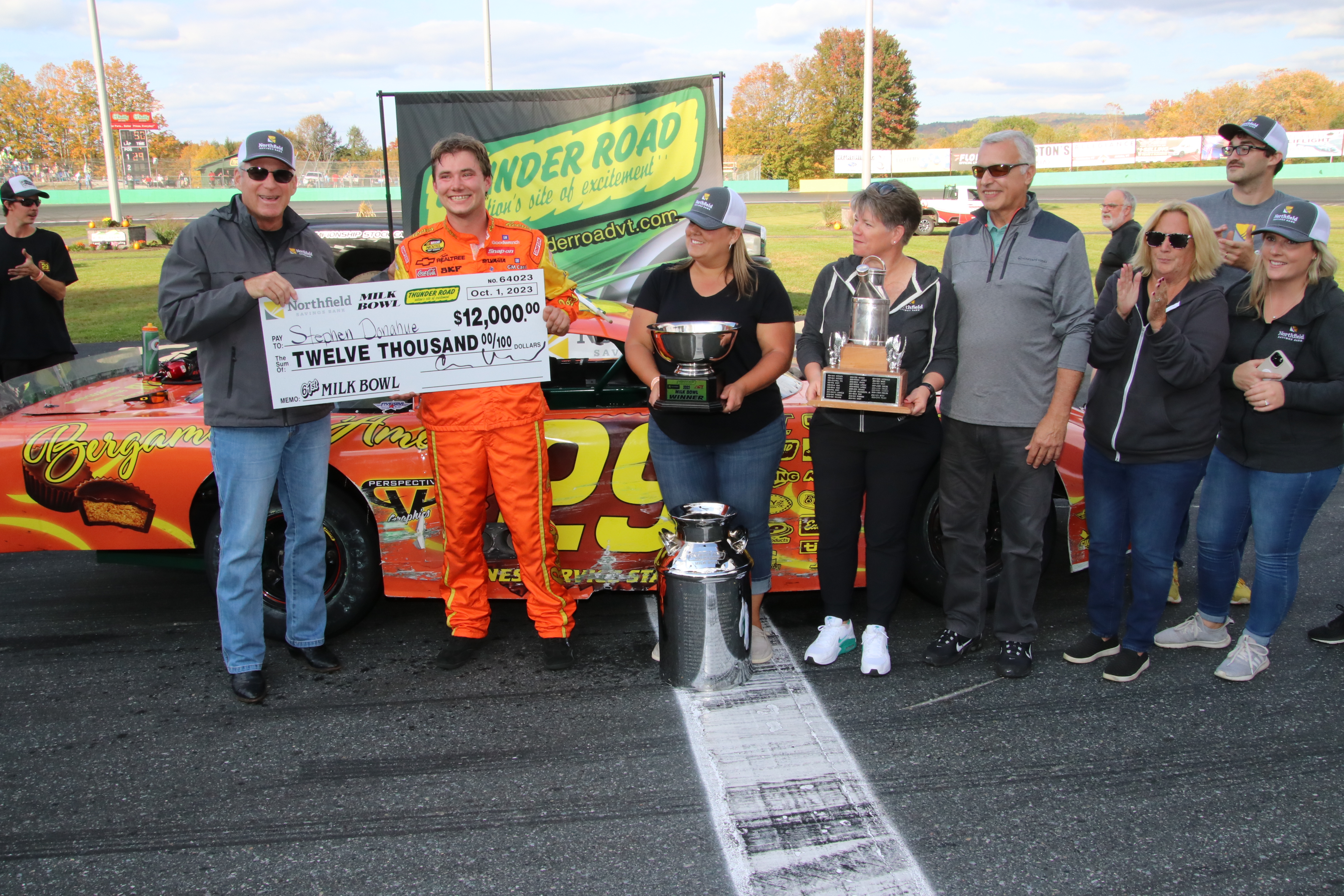 Team NSB presents Milk Bowl winner Stephen Donahue with a prize check.