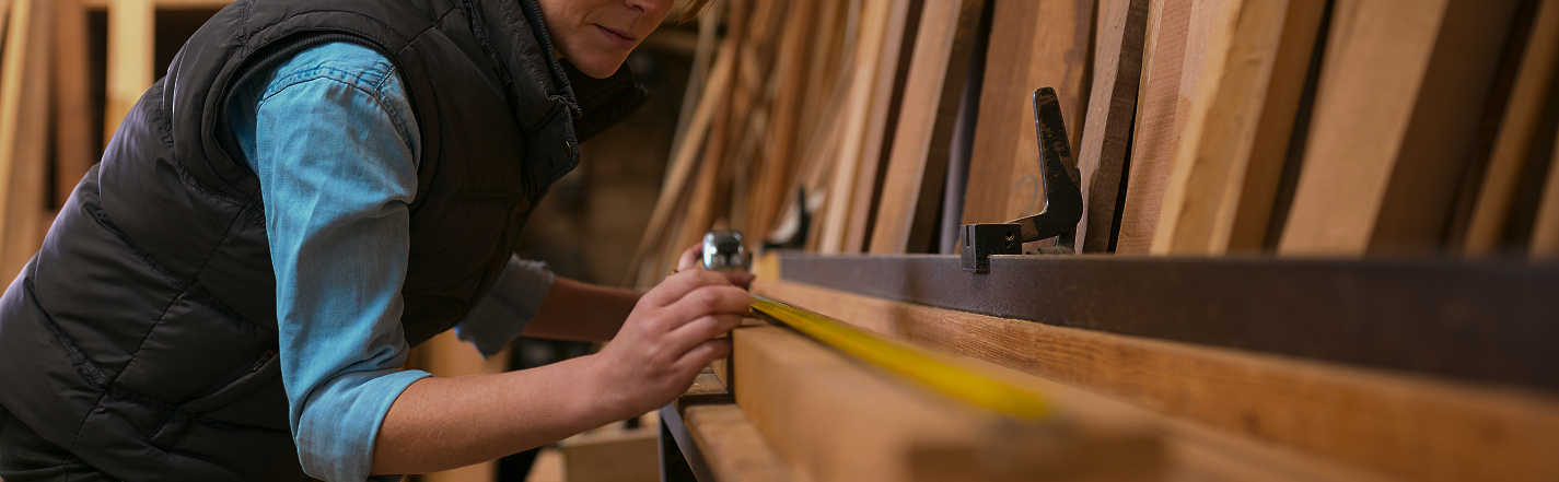 female carpenter working in woodwork workshop