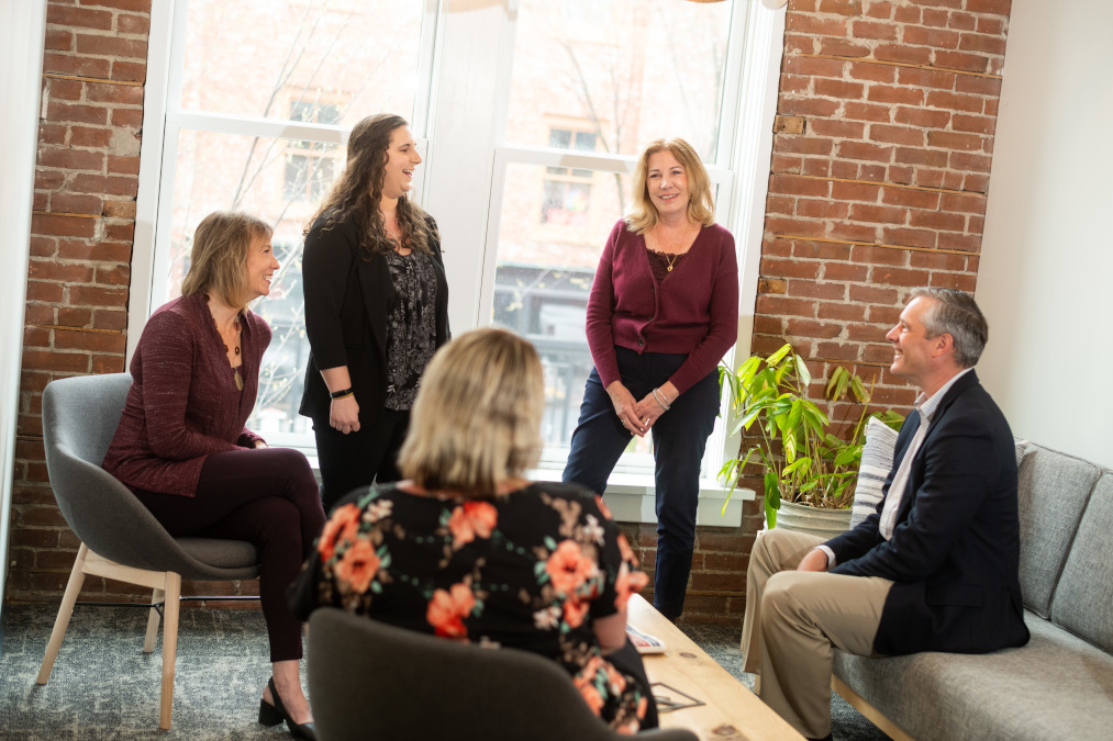 Mortgage team meeting in corner