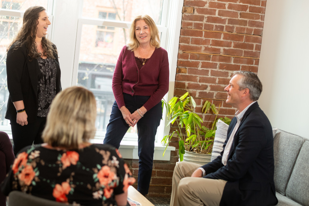 Mortgage team meeting in corner