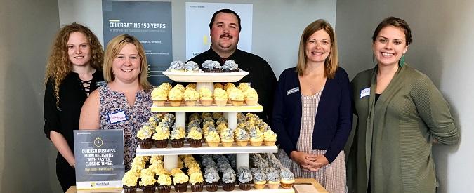 NSB staff with branded cupcakes