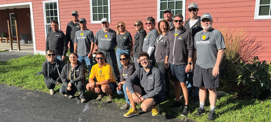 NSB employees pose for a photo at Camp Ta-Kum-Ta